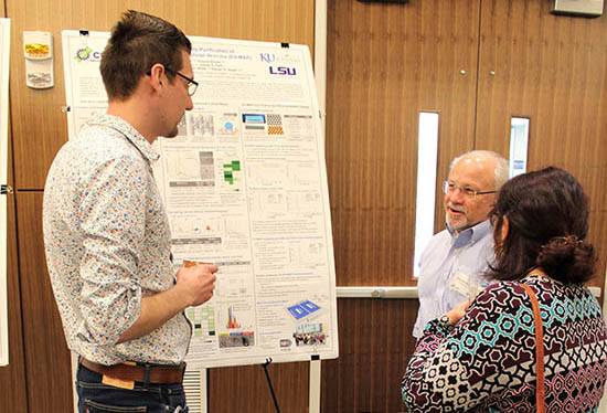 Prof. Steven Soper chats with Matt Jackson and Maggie Witek at the poster session