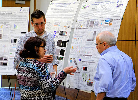 Maggie Witek discusses research with Prof. Soper and Matt Jackson.