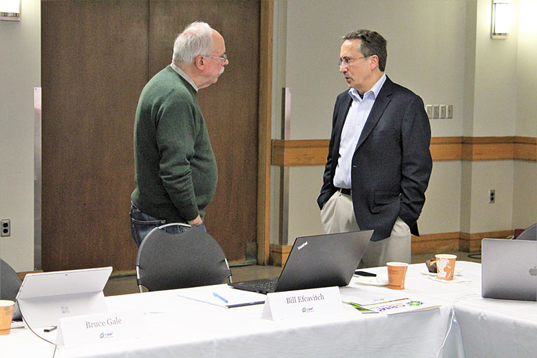 Dr. Bill Efcavitch (left) and Dr. Andrew Godwin (right) network during breakfast