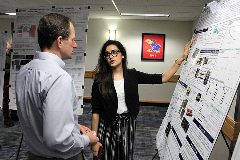 Graduate student Sachindra Thippalagamage presents her poster to EAB member Dr. Bruce Gale