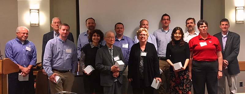 The invited speakers all received KU Chemistry Department beakers for their contribution to the symposium