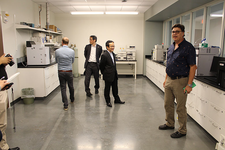 Dr. Ueda and Mr. Kaito check out the Shimadzu instruments in a teaching lab
