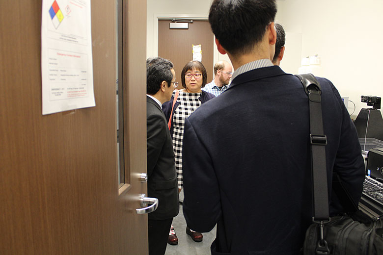 Dr. Minae Mure shows her lab to the Shimadzu visitors