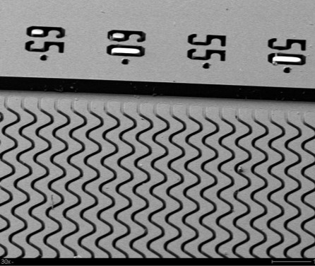 Monochrome image showing wavy patterns below numerical indicators "55".