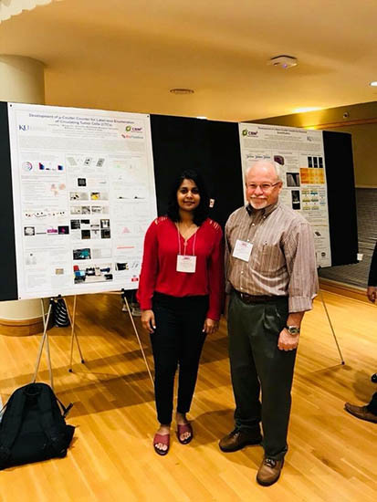 Charuni Amarasekara and Prof. Steven Soper check out the poster session at the ACS Midwest Regional Meeting.