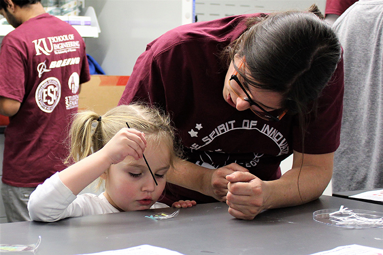 Jenny helping little girl