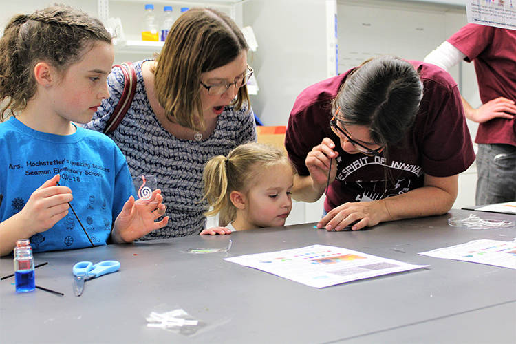 Jenny explaining to little girl